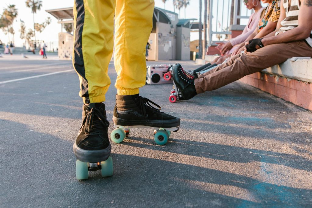 Urban roller skating scene featuring colorful attire and vibrant energy on a sunny day.